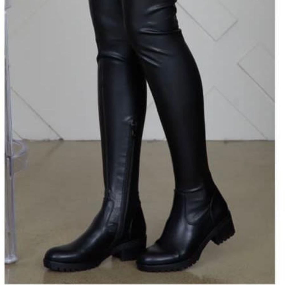 Thigh high flat boots